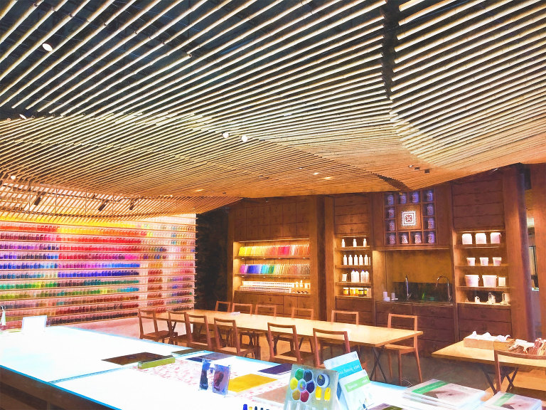 Pigment store ceiling and tables in front of shelves